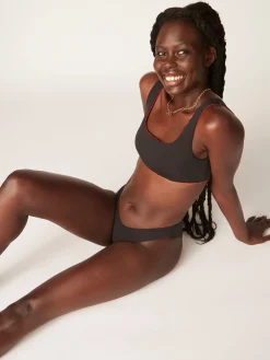 Modibodi Braga bikini clásica menstrual nailon reciclado negra absorción ligera moderada