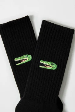 Meias altas pretas de algodão orgânico com estampa de crocodilo