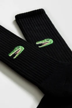 Meias altas pretas de algodão orgânico com estampa de crocodilo