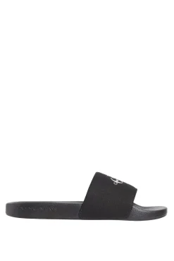 Calvin Klein Sandalias slides con logo grabado.