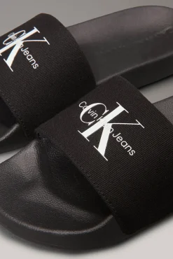 Calvin Klein Sandalias slides con logo grabado.